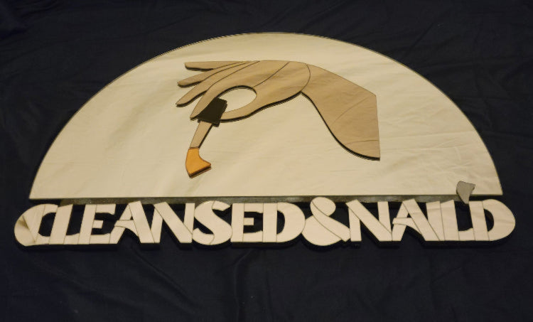 mirror design with a hand holding a nail polish brush over the words cleansed and nail'd